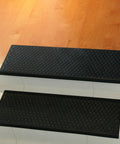 Coin Grip Grippy Non Slip Rubber Tread Stair Mats 6 Pack Black Easy Clean Durable Staircase Mats on wooden steps