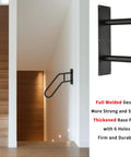 Heavy Duty Wrought Iron Handrails For Outdoor Steps And Indoor Stairs Built Like A Tank With Rustproof Frosted Black Finish Wall Mount, installed beside wooden stairs.
