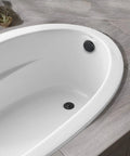 Matte Black Lift and Turn Tub Drain Stopper Kit With Two-Hole Overflow Faceplate No-Putty Gasket installed in white bathtub