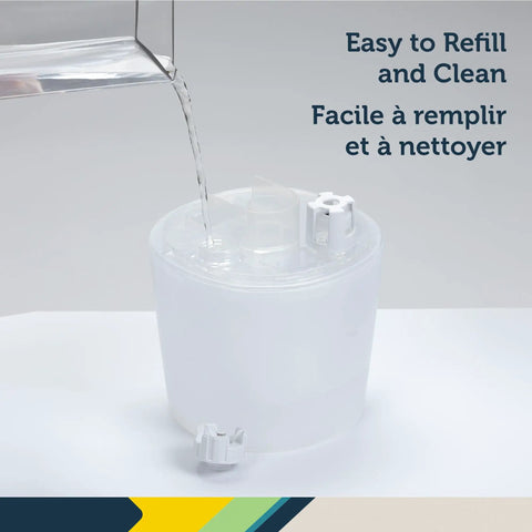Filter Free Humidifier With Auto Humidity Control And Hygrometer being refilled with water, easy to clean and maintain.