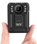 Hand holding 1440P UHD Ambarella H22 Body Worn Camera With 128GB Memory, showing front view with lens and LEDs.
