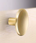 Premium Quality Gold Cabinet Knobs For Modern Kitchen And Bedroom Drawers Durable Zinc Alloy Furniture Handles Boasting No Sweat Installation Steps For A Swanky Home Renovation Refresh, close-up view of brushed gold knob.