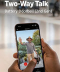 Real Deal Battery Wireless Doorbell Camera Bundle In Speckled Gray Finish With Kickin 2K Hd Video and Retinal 6X Zoom showing live view on smartphone.