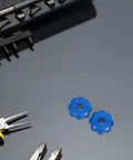 Heavy Duty Gas Cylinder Valve Handles Set of 4 with Hexagonal Aluminum Alloy Industrial Hand Wheels Non Slip Grip for Emergency Valve Opening and Laboratory Use, blue handles on a grey surface surrounded by tools.