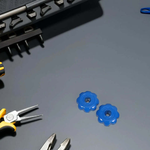 Heavy Duty Gas Cylinder Valve Handles Set of 4 with Hexagonal Aluminum Alloy Industrial Hand Wheels Non Slip Grip for Emergency Valve Opening and Laboratory Use, blue handles on a grey surface surrounded by tools.