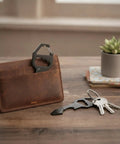 Ultra Slim Metal Credit Card Multitool With Bottle Opener And Hex Key for wallet or keychain next to leather wallet and keys