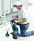 Technician using Nitrogen Sludge Sucker And Blaster Kit With Metal Carrying Stand For 40 Cubic Feet Tank Pro HVACR Gear Featuring 400 PSI