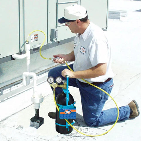 Technician using Nitrogen Sludge Sucker And Blaster Kit With Metal Carrying Stand For 40 Cubic Feet Tank Pro HVACR Gear Featuring 400 PSI