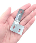 Close-up of stainless steel door alignment bracket in hand, part of a hardware kit for bi-fold, sliding, and closet doors.