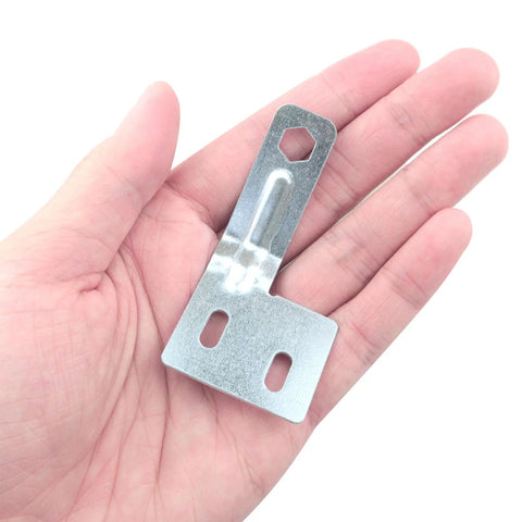 Close-up of stainless steel door alignment bracket in hand, part of a hardware kit for bi-fold, sliding, and closet doors.
