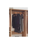 Custom Walk In Closet System With Sturdy Wooden Drawers And Flexible Shelves Modular Wardrobe Organizer Featuring Hanging Rods and dresses hung up.