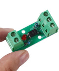 Close-up of One Channel PC817 Optocoupler Isolation Module for PLC drives and motor control, rail mount, dual green terminal blocks visible.