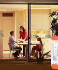 Dimmable LED Driver 12V DC 60W Quiet Operation Universal Regulated Power Supply next to a family dining in a well-lit room.