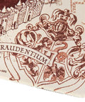 Corner detail of the Harry Potter Marauder's Map Desk Mat XXL Gaming Desk Pad featuring map artwork, waterproof neoprene surface.