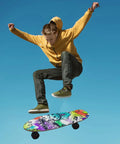 Skateboarder mid-air showing Street Art Graffiti Grip Tape For Skateboards And Longboards, Bubble Free Anti Slip Deck Sheet 33 X 9 Inches