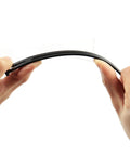 Hands holding flexible 100 Pack Drip Irrigation Stakes For One Quarter Inch Tubing, demonstrating durability and design