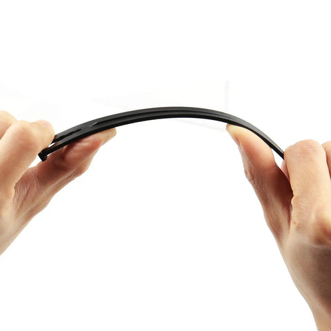 Hands holding flexible 100 Pack Drip Irrigation Stakes For One Quarter Inch Tubing, demonstrating durability and design