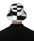 Fire Black And White Piano Grid Print Bucket Hat With Double Sided Reflective Trim Unisex Lightweight Polyester Sun Shield Cap For Summer Vibes And Travel from the back on model.