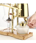 Top Shelf Siphon Coffee Maker serving up smooth brews with heavy duty glass and classic retro styling in action.