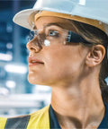 Person wearing All Day Comfort Safety Glasses For Work, Lab, And Construction, ANSI Z87.1 Impact Resistant Eye Protection For Men And Women.