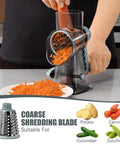 Rotary Cheese Grater Hand Crank No-Fuss Transparent Shredder slicing carrots with coarse shredding blade in kitchen