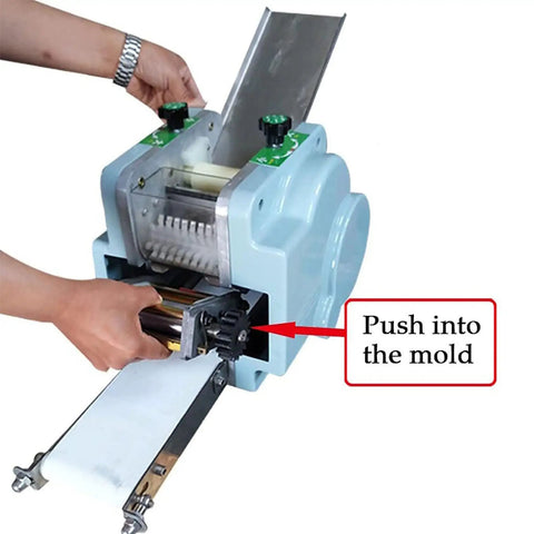 Automatic Dumpling Skin Maker 140W Electric Dough Processor with slick waterproof housing, showing user inserting dough into mold.