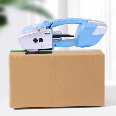 Heavy Duty Electric Rechargeable PET PP Strapping Tool 3 In 1 Bander With Auto Cut And Hot Weld For Shipping Boxes And Pallets on cardboard box.