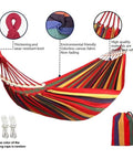 Rainbow Cotton Canvas Hammock With Tree Straps And Bar, Ultra Comfy Durable Fabric That Conforms To Your Body, Supports Up To 440 Lbs, Includes Travel Bag For Camping Outdoor Or Indoor Patio Backyard Hangout with colorful stripes displayed alongside tree straps and travel bag.
