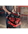 Person organizing tools in VersaStack Zippered Tool Bag With 31 Pocket Organizer Built For Heavy Duty Hauling Durable 1680 Denier Fabric