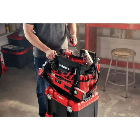 Person organizing tools in VersaStack Zippered Tool Bag With 31 Pocket Organizer Built For Heavy Duty Hauling Durable 1680 Denier Fabric