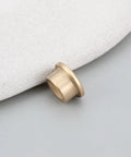 8 Pack Flanged Copper Sleeve Bushings 8 Mm Bore 12 Mm OD 8 Mm Long on a smooth surface, showing copper material and flanged design.