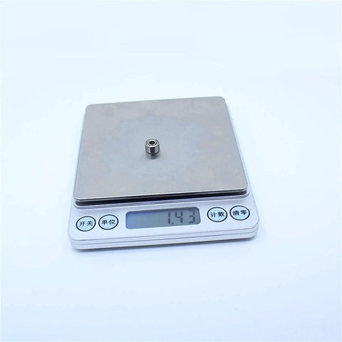Heavy Duty 603ZZ And 603Z Miniature Ball Bearings Featuring Super Smooth ABEC-1 Ratings on a scale, weighing 1.43g.