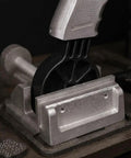 Lockdown Gun Vise Block For AR Rifle And Glock Pistol Heavy Steel Table Fixture with secure grip and silver finish.