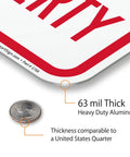 Close-up of Tough As Nails No Parking Private Property Sign 12 X 18 Inch Heavy Duty Aluminum Sheet showing 63 mil thickness beside a quarter.