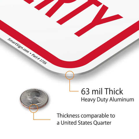 Close-up of Tough As Nails No Parking Private Property Sign 12 X 18 Inch Heavy Duty Aluminum Sheet showing 63 mil thickness beside a quarter.