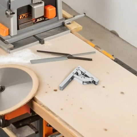 Four Pack Short Arm Cabinet Hinges With Wide Angle Design For 90 Degree Openings on workshop table next to tools.