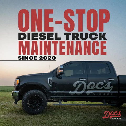 Black diesel truck with Doc's Diesel logo and 'One-Stop Diesel Truck Maintenance Since 2020' text in a field
