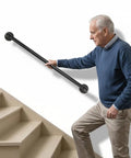 Built Like A Tank 3Ft Metal Industrial Stair Railing With Heavy Duty Black Powder Coated Finish Rust Proof Handrail Support For Indoor Outdoor Workspaces And Country Charm. Senior man using stair railing.