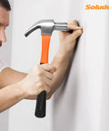 Man using hammer from 148-Piece Home Repair Tool Kit With Case For DIY Projects, Dorm Essentials, and Everyday Home Maintenance.