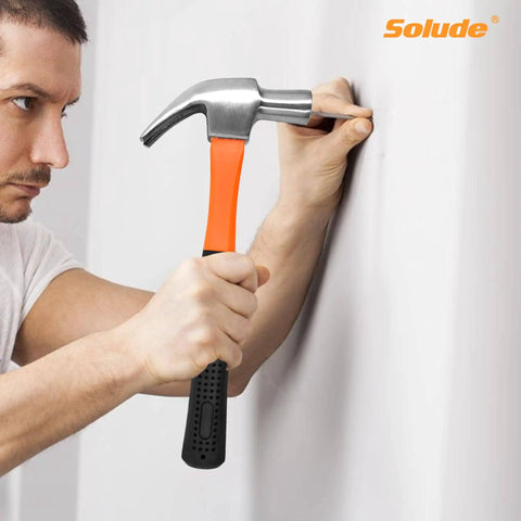 Man using hammer from 148-Piece Home Repair Tool Kit With Case For DIY Projects, Dorm Essentials, and Everyday Home Maintenance.