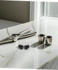 Get These 4Pc Industrial Spring Plunger Pins For Your Machine Shop displayed with pliers and sockets on a countertop.