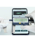 Digital Outside Neck Caliper With Built In Wireless Data Transmission; Measures Grooves And Recesses In mm Or Inches; Stainless Steel, IP54 Rated, 6 Inch Capacity; Quick Device Sync For Precise, Pro Grade Machining Measurements, shown measuring with a smartphone.