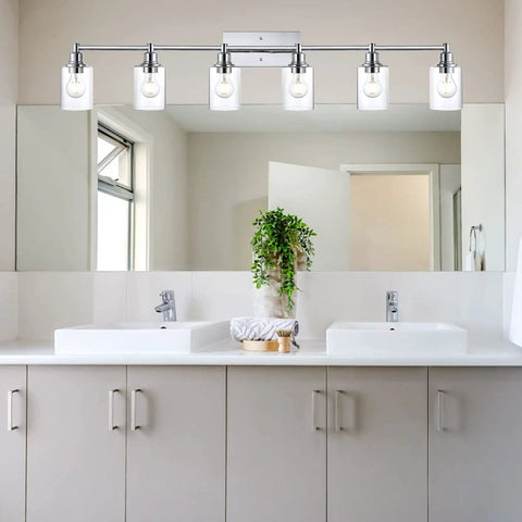 Dope Three Light Vanity Fixture In Brushed Nickel Finish With Clear Glass Cylinder Shades Over Mirror Bathroom Lighting