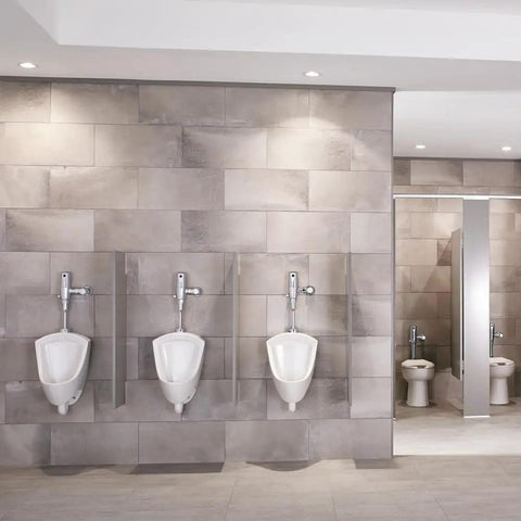 Pintbrook Top Spud Urinal High Efficiency Flush 0.125 to 0.5 GPF White in a modern restroom with tiled walls.