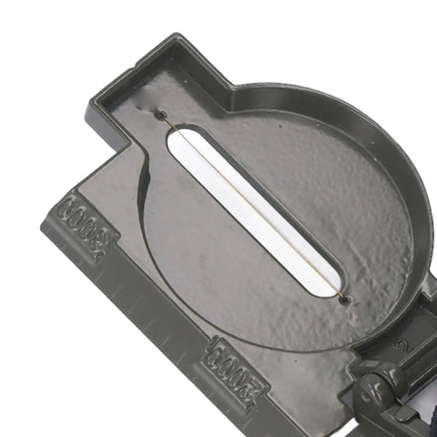 Close-up of durable alloy survival compass with metal cover for hiking camping