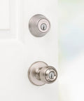 Polo Entry Knob And Deadbolt Combo Pack, Satin Nickel Finish, installed on white door, front view of single cylinder