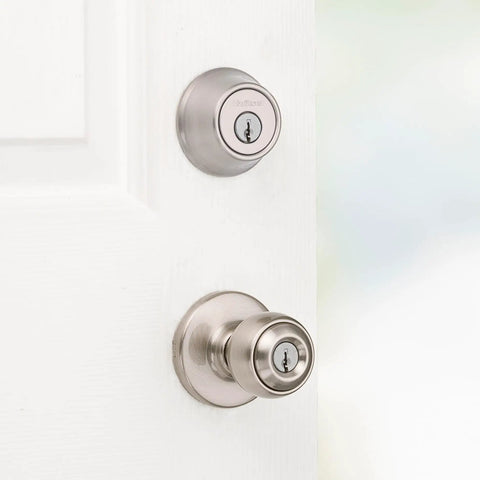 Polo Entry Knob And Deadbolt Combo Pack, Satin Nickel Finish, installed on white door, front view of single cylinder