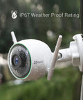 White Outdoor Security Cam with Color Night Vision, AI Person Detection, 1080P, H.265, IP67 Waterproof, mounted outdoors