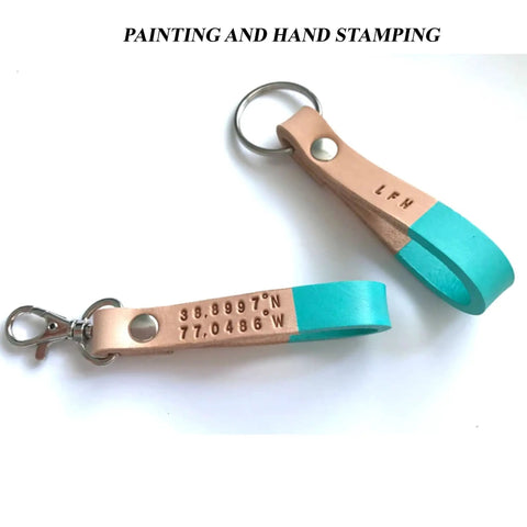 Two half inch natural vegetable tanned leather keychain blanks ready for custom stamping with snap hooks.