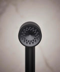 Front view of Matte Black Single Function Hand Shower With Hourglass Spray Pattern Delivers Consistent 2.5 GPM Rinse And Targeted Massage